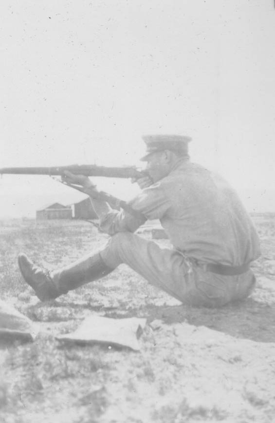 McMullen Firing a Rifle From a Seated Position, Ca. 1928-30 (Source: Barnes) 